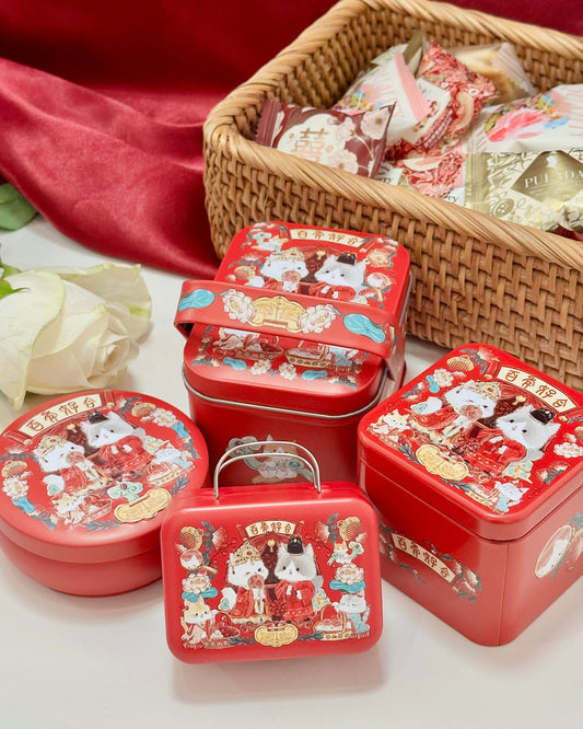 Set of red wedding tins with cute couple cat cartoon characters with a basket of sweet treats